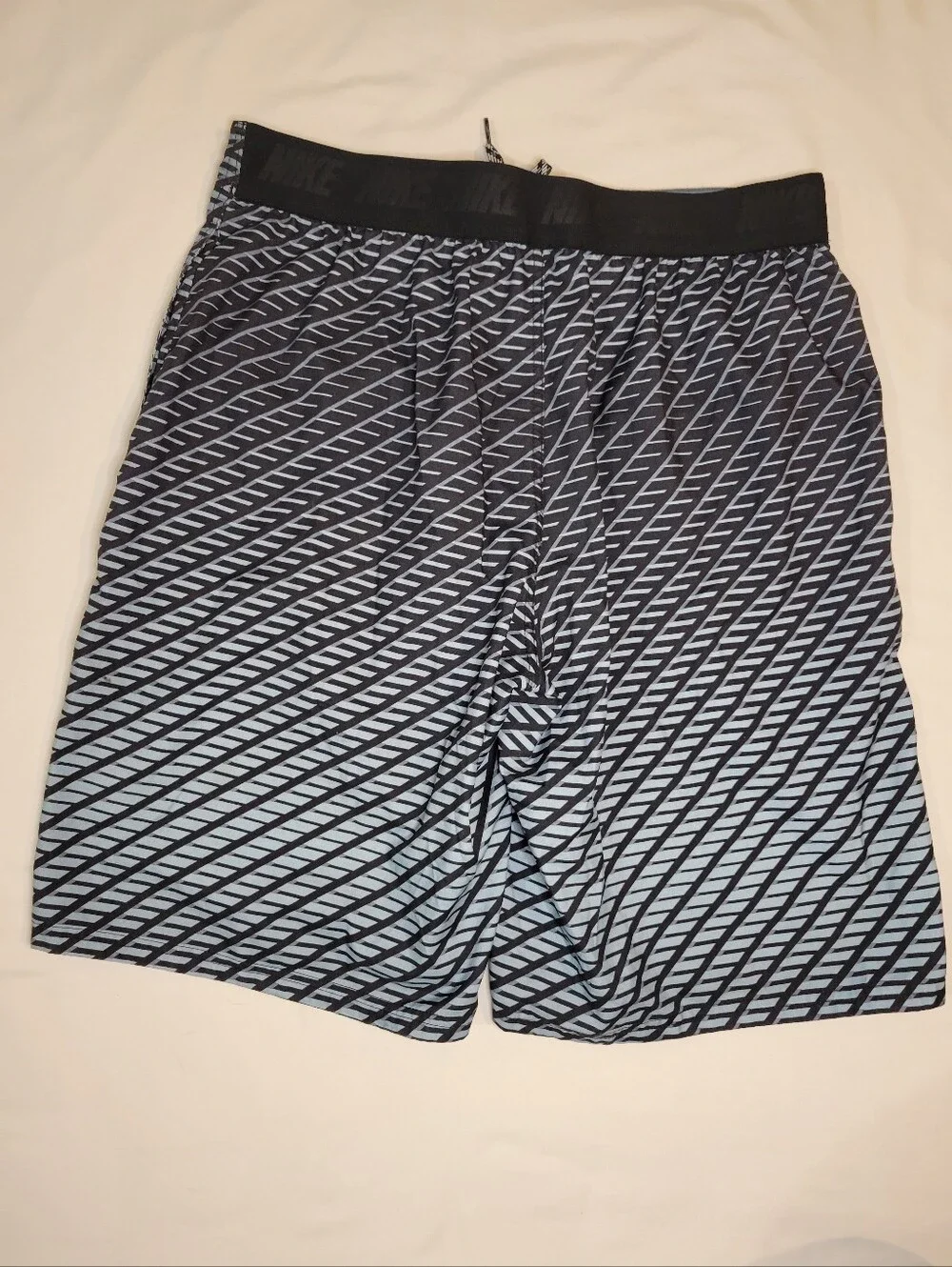 Nike Men's Blue and Black Diagonal Stripe Swim Trunks
